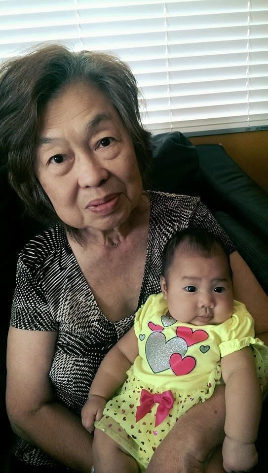 Victoria holding a baby