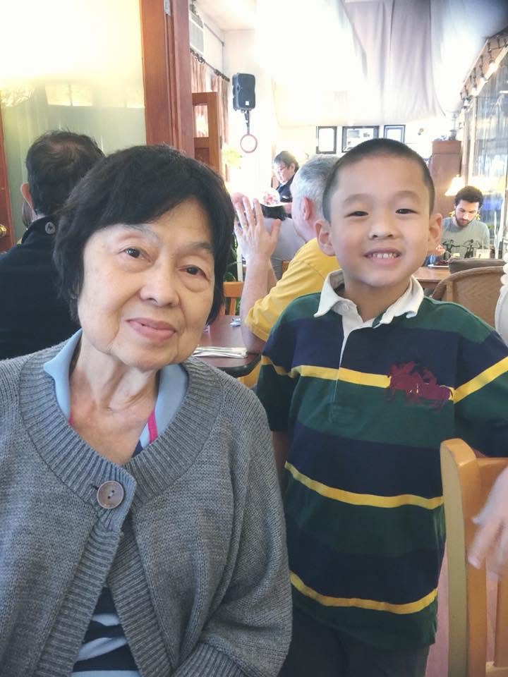 Victoria seated beside a child