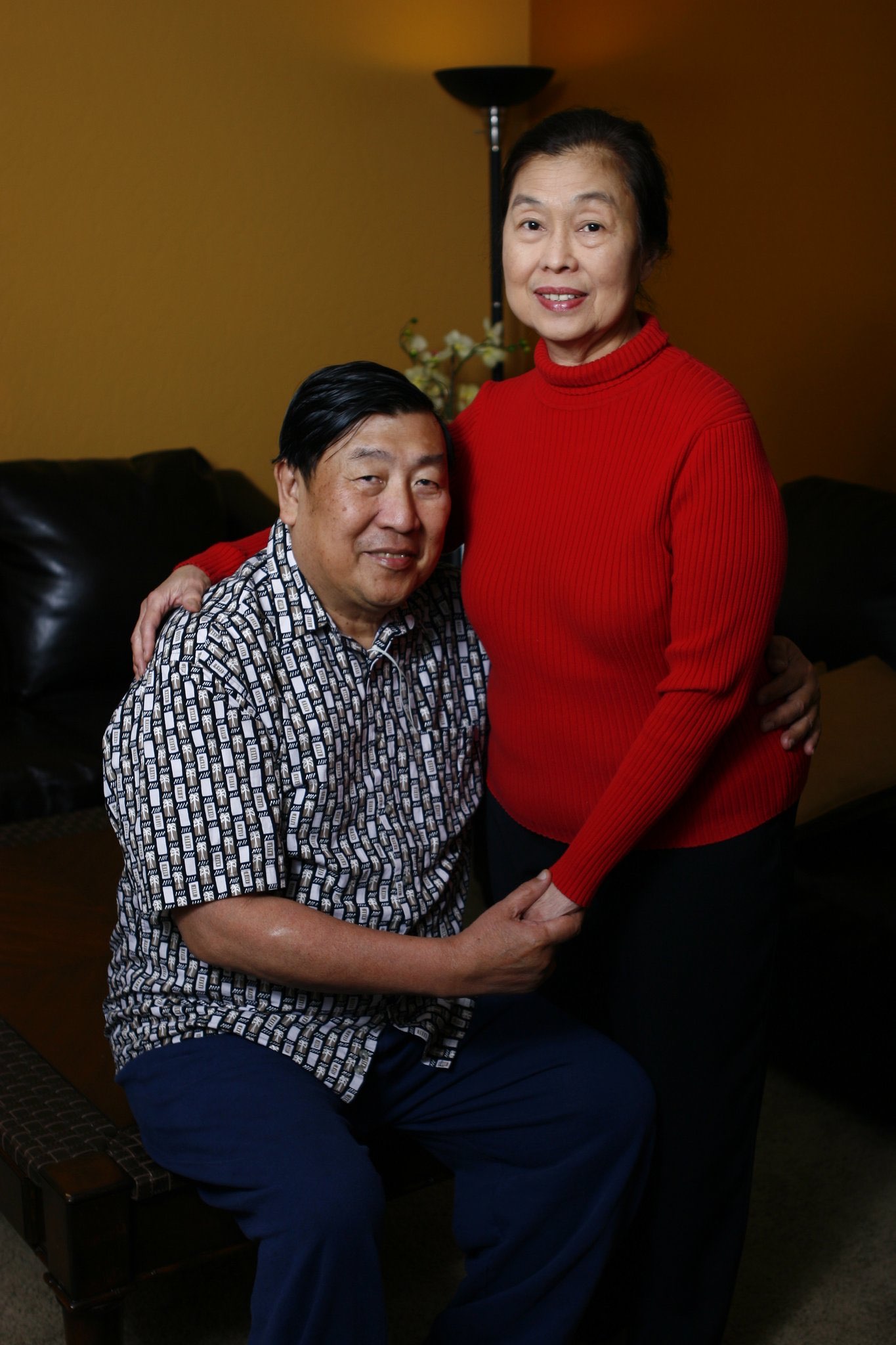 Mom and Dad smiling together in a living room