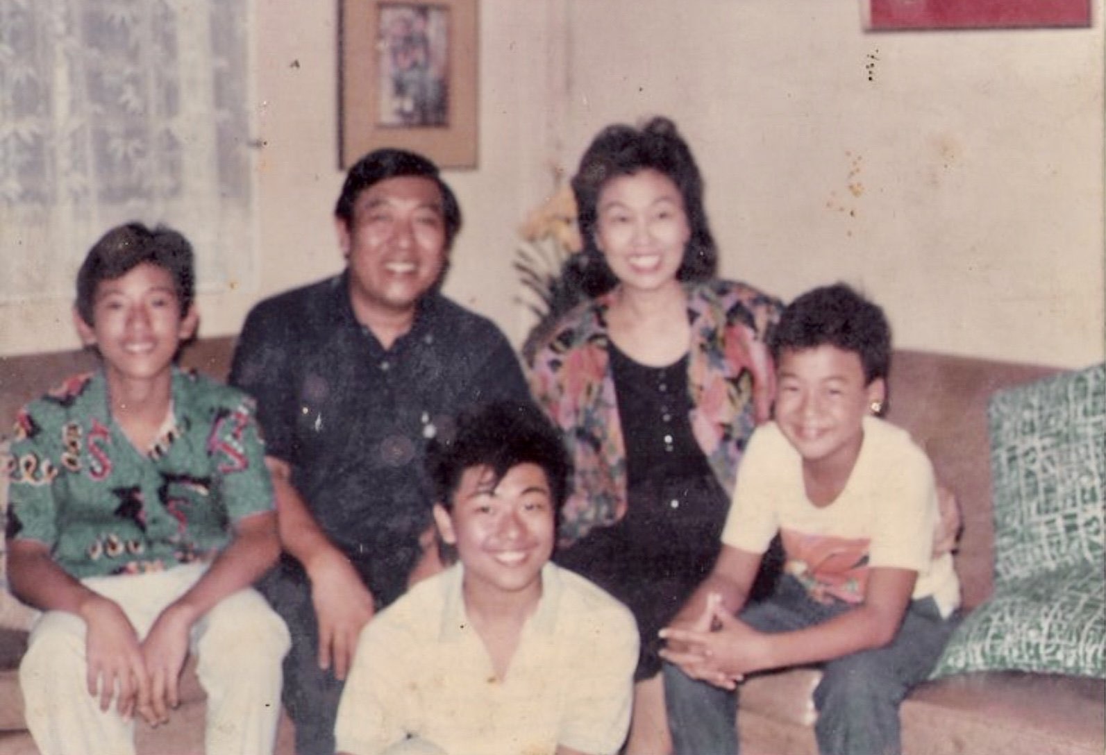 Vintage family photo seated together on a couch