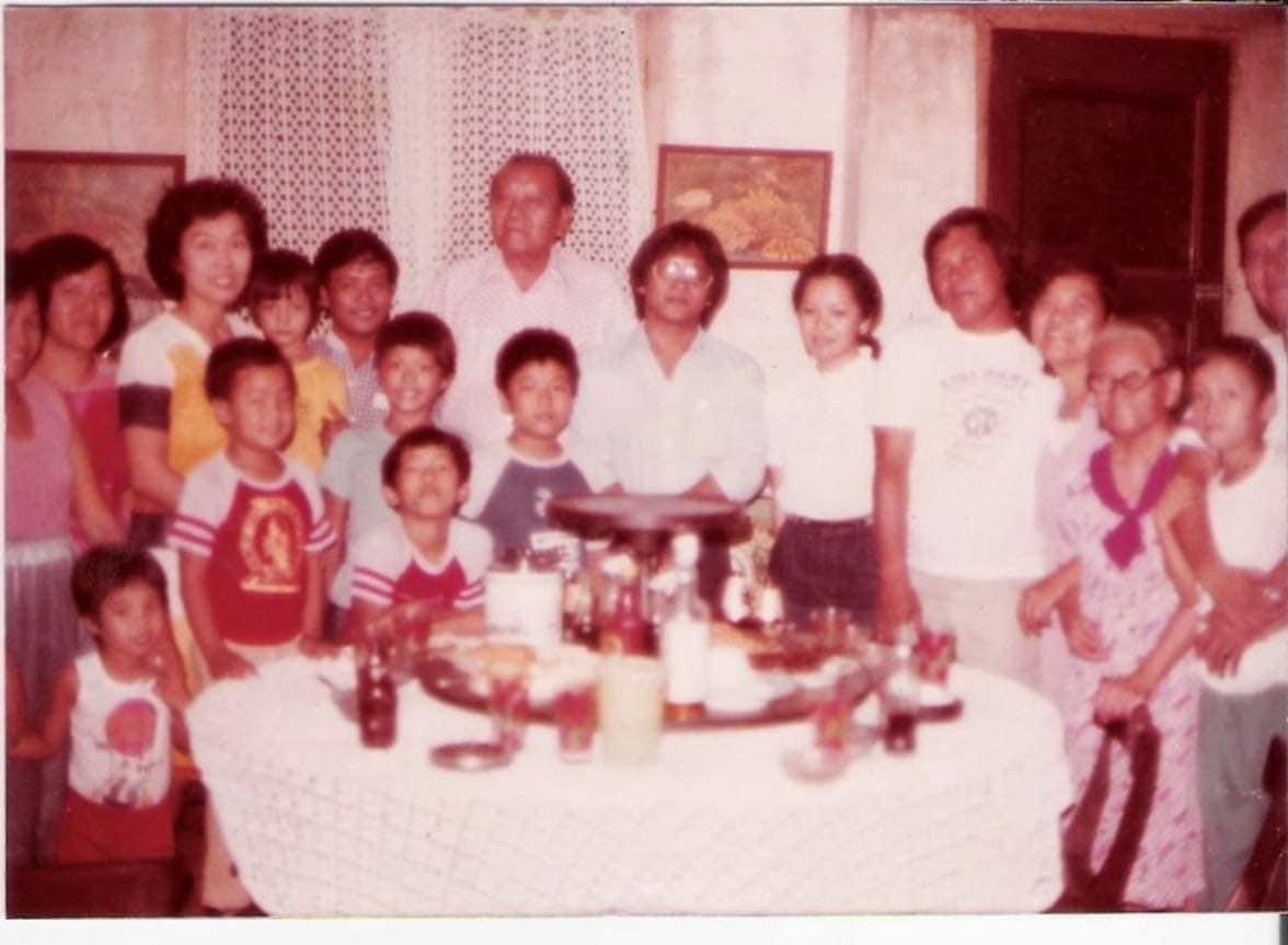 Large family gathering around a table